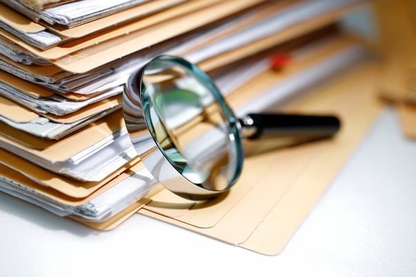 Carefully combing through Loan Docs with a magnifying glass