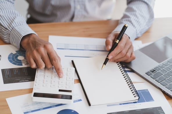vecteezy_businessman-working-with-financial-report-talking-about_7143574_705